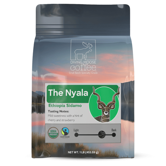 The Nyala Ethiopia Sidamo Organic Medium-Dark Roast coffee with dark chocolate and berry notes in eco-friendly packaging