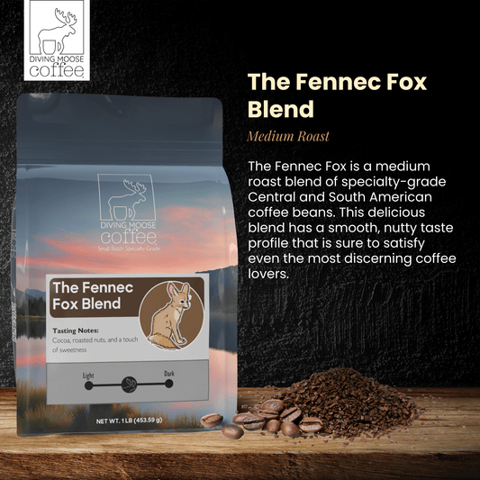 The Fennec Fox medium roast coffee blend bag with coffee beans and grounds on wooden surface