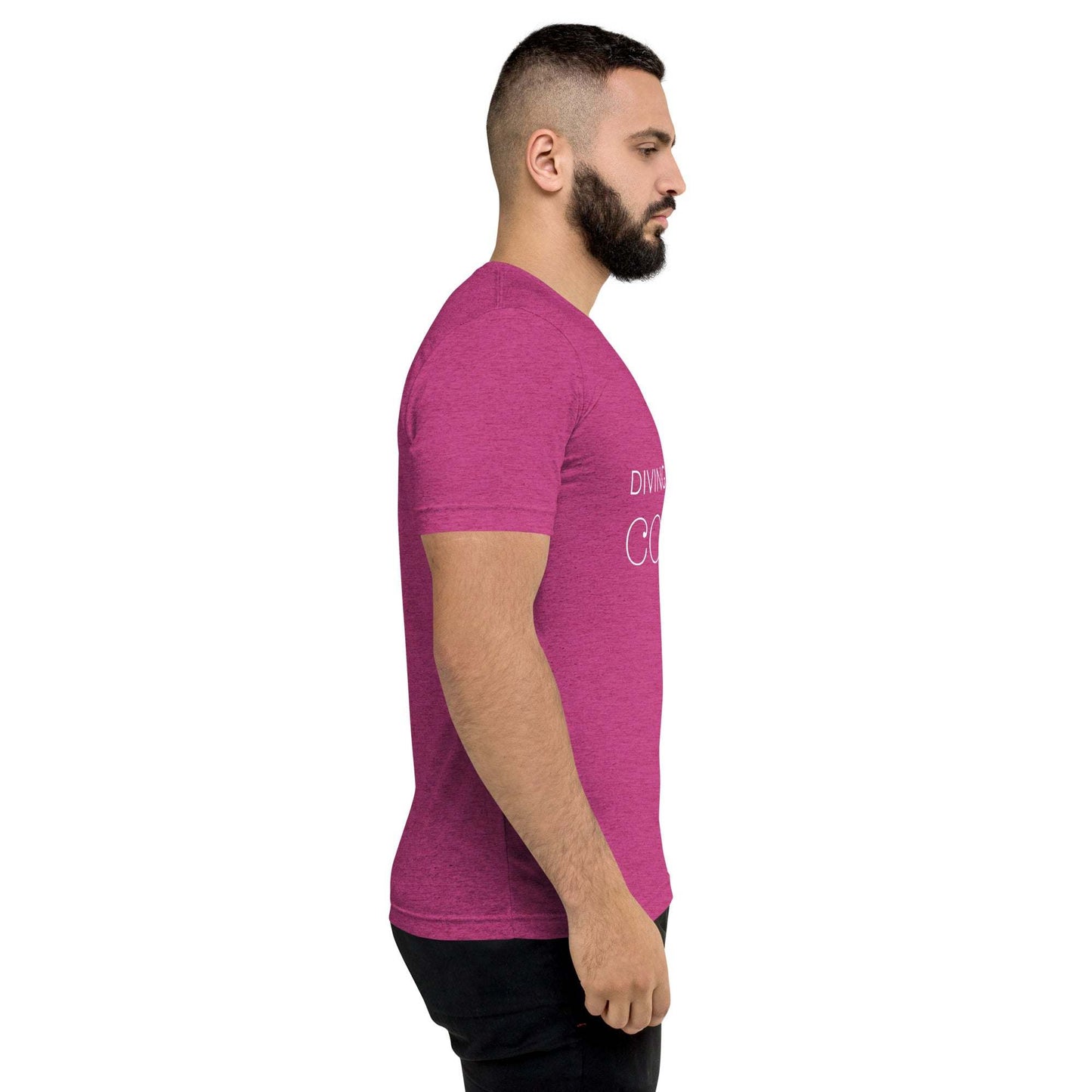 Man wearing a magenta DMC Word Logo tri-blend comfy short sleeve t-shirt with a side QR code on the sleeve, shown from the side.