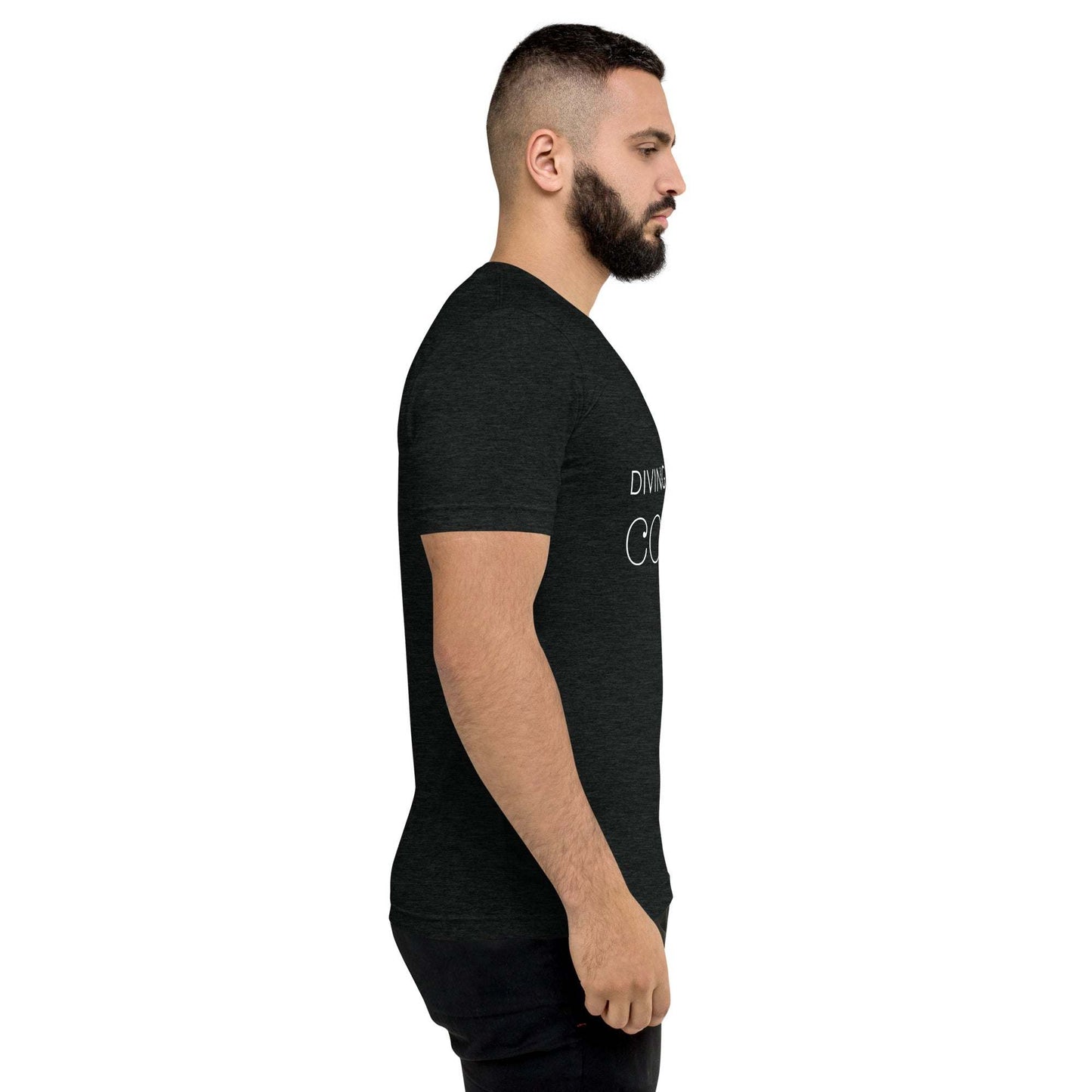 Side view of man wearing black DMC Word Logo tri-blend t-shirt with QR code on sleeve