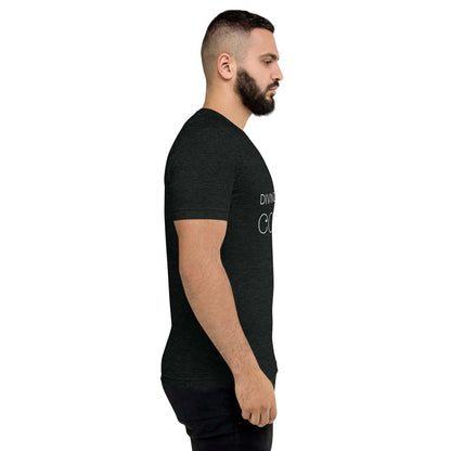 Side view of man wearing black DMC Word Logo tri-blend t-shirt with QR code on sleeve