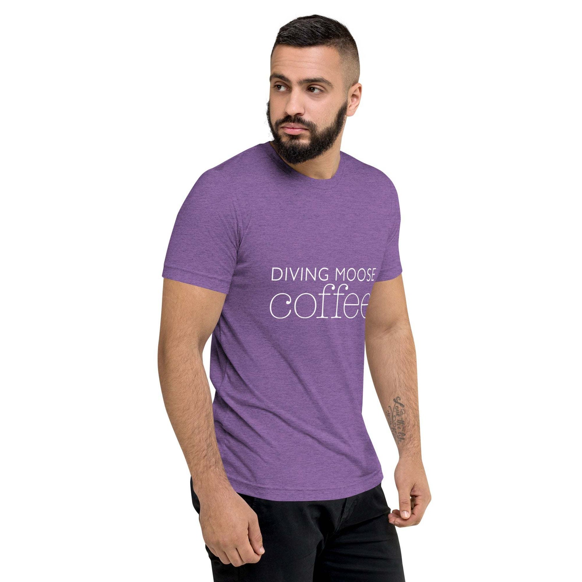 man wearing purple DMC Word Logo short sleeve tri-blend t-shirt with Diving Moose Coffee text and QR code on sleeve
